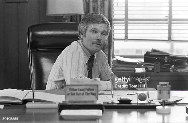 Cable television mogul Ted Turner is photographed at his desk in his office at Turner Broadcasting System on January 28, 1977 in Atlanta, Georgia.