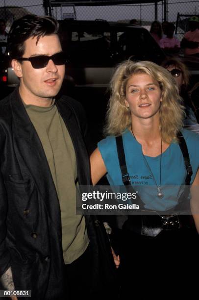 Actor Charlie Sheen and adult film actress Ginger Lynn attend Second Annual Reid Rondell Stunt Foundation Enduro 150 on October 6, 1990 at Saugus...