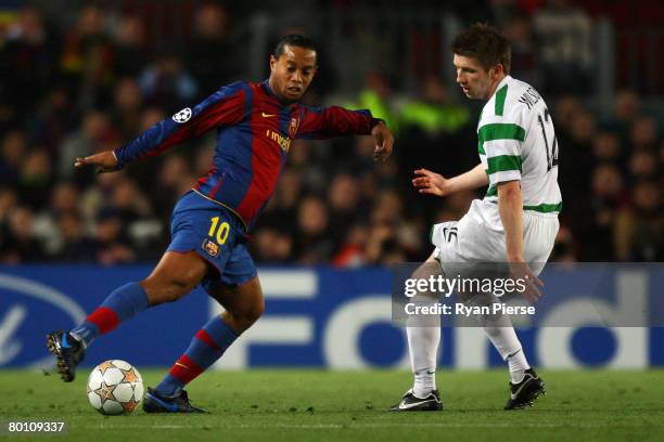 Ronaldinho of Barcelona gets past Mark Wilson of Celtic during the UEFA Champions League 2nd leg of the First knockout round match between FC...