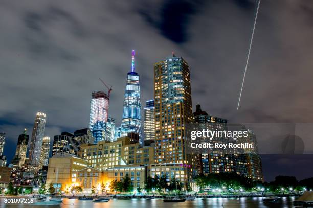 View of lower Manhattan from Pride Island showing One WTC tower diplaying the colors of the Pride flag during New York City Pride 2017 - Pride Island...