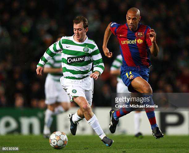 Thierry Henry of Barcelona chases Aiden McGeady of Celtic during the UEFA Champions League 2nd leg of the First knockout round match between FC...