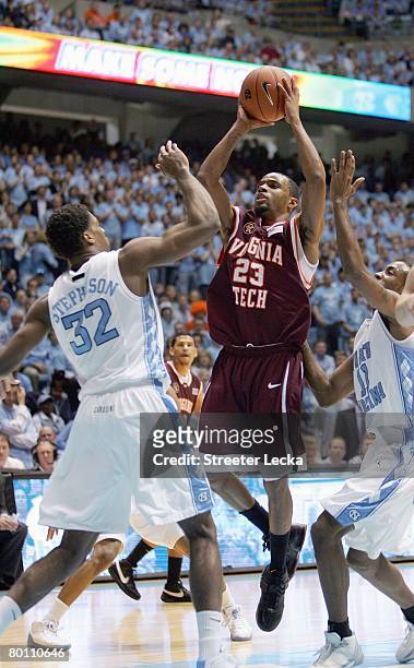 Malcolm Delaney of the Virginia Tech Hokies takes a shot against Alex Stepheson of the North Carolina Tar Heels at the Dean E. Smith Center on...