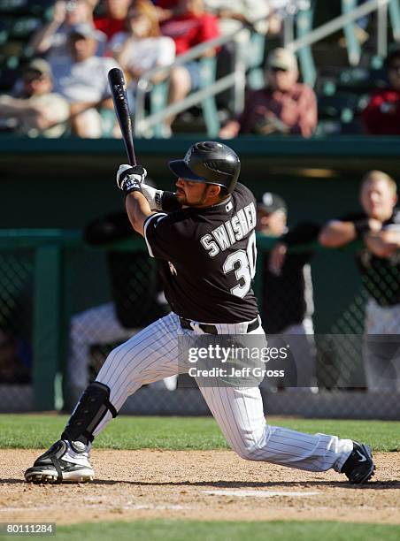 Nick Swisher of the Chicago White Sox hits a double in the ninth inning, scoring the winning run against the Los Angeles Angels of Anaheim during a...