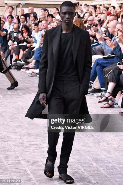 Model walks the runway during the Berluti Menswear Spring/Summer 2018 show as part of Paris Fashion Week on June 23, 2017 in Paris, France.