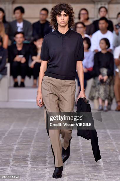 Model walks the runway during the Berluti Menswear Spring/Summer 2018 show as part of Paris Fashion Week on June 23, 2017 in Paris, France.