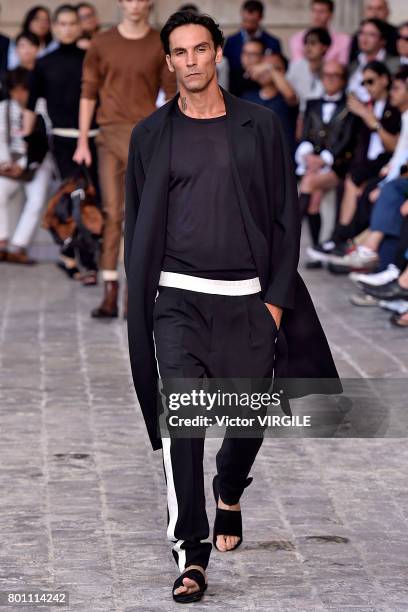 Model walks the runway during the Berluti Menswear Spring/Summer 2018 show as part of Paris Fashion Week on June 23, 2017 in Paris, France.