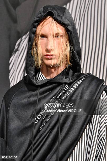 Model walks the runway during the Juun J Menswear Spring/Summer 2018 show as part of Paris Fashion Week on June 23, 2017 in Paris, France.