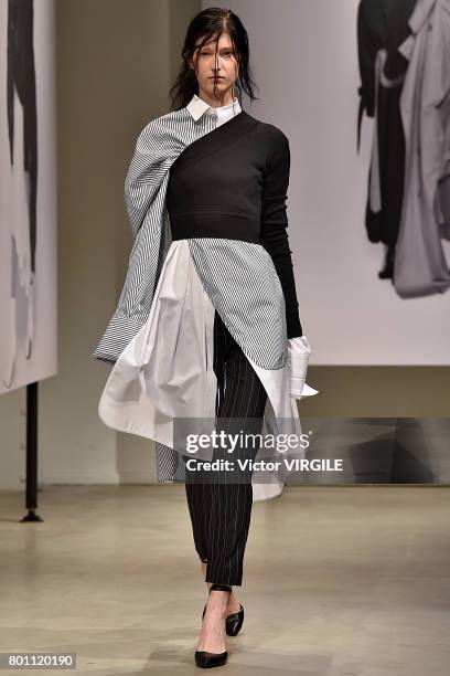 Model walks the runway during the Juun J Menswear Spring/Summer 2018 show as part of Paris Fashion Week on June 23, 2017 in Paris, France.