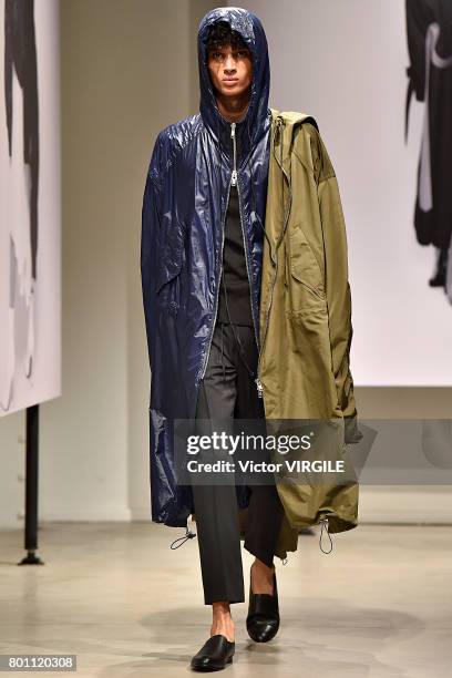 Model walks the runway during the Juun J Menswear Spring/Summer 2018 show as part of Paris Fashion Week on June 23, 2017 in Paris, France.