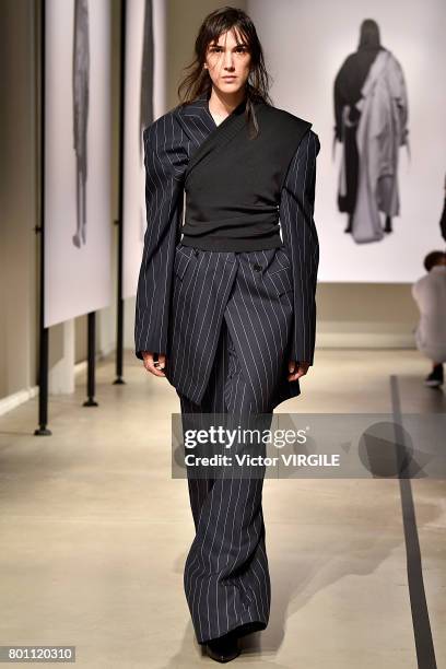 Model walks the runway during the Juun J Menswear Spring/Summer 2018 show as part of Paris Fashion Week on June 23, 2017 in Paris, France.