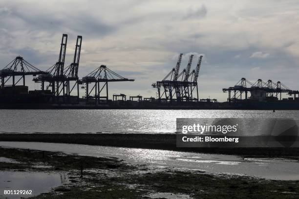 Ship-to-shore cranes stand on the dockside at the Port of Felixstowe Ltd., a subsidiary of CK Hutchison Holdings Ltd., in Felixstowe,, U.K., on...