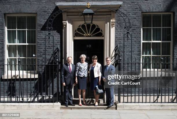 Britain's Prime Minister, Theresa May , greets Arlene Foster, the leader of Northern Ireland's Democratic Unionist Party , deputy leader of the...