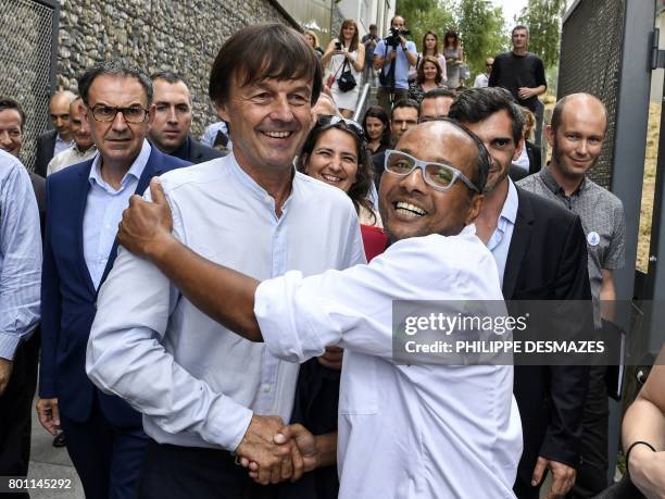 French Minister of Ecological and Inclusive Transition Nicolas Hulot is greeted during his visit on June 26, 2017 in the new district of Confluence...