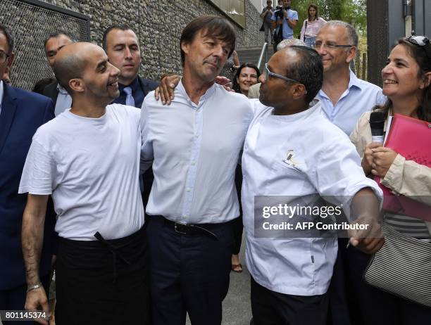 French Minister of Ecological and Inclusive Transition Nicolas Hulot is greeted by people during his visit on June 26, 2017 in the new district of...