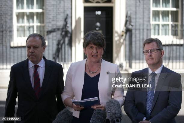 Democratic Unionist Party leader Arlene Foster addresses the media, flanked by DUP Deputy Leader Nigel Dodds , and DUP MP Jeffrey Donaldson, outside...