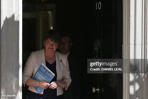 Democratic Unionist Party leader Arlene Foster exits 10 Downing Street to address the media in central London on June 26 following her meeting with...