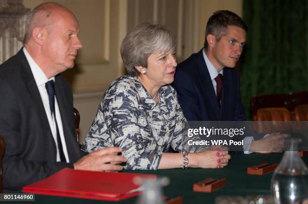 Prime Minister Theresa May sits with First Secretary of State Damian Green , and Parliamentary Secretary to the Treasury, and Chief Whip, Gavin...