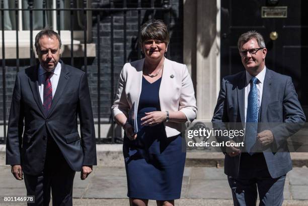 Arlene Foster , the leader of Northern Ireland's Democratic Unionist Party, party deputy leader, Nigel Dodds and MP Jeffrey Donaldson , leave after...