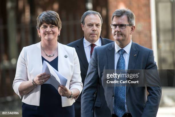 Arlene Foster , the leader of Northern Ireland's Democratic Unionist Party, party deputy leader, Nigel Dodds and MP Jeffrey Donaldson , leave after...