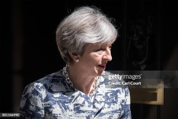 Britain's Prime Minister, Theresa May prepares to greet Arlene Foster, the leader of Northern Ireland's Democratic Unionist Party, deputy leader of...