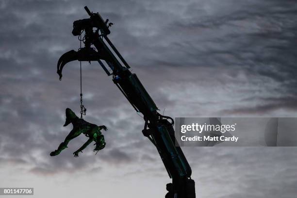 People watch the Arcadia show at the Glastonbury Festival site at Worthy Farm in Pilton on June 25, 2017 near Glastonbury, England. Glastonbury...