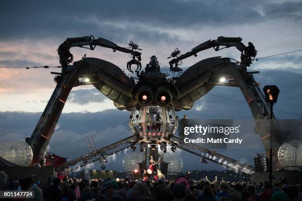 People watch the Arcadia show at the Glastonbury Festival site at Worthy Farm in Pilton on June 25, 2017 near Glastonbury, England. Glastonbury...