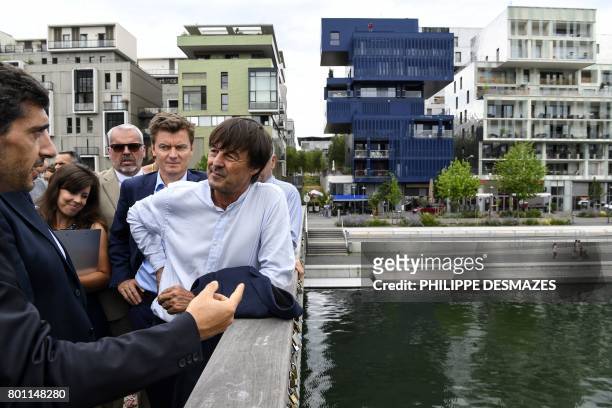 French Minister of Ecological and Inclusive Transition Nicolas Hulot listens to explanations during his visit on June 26, 2017 in the new district of...