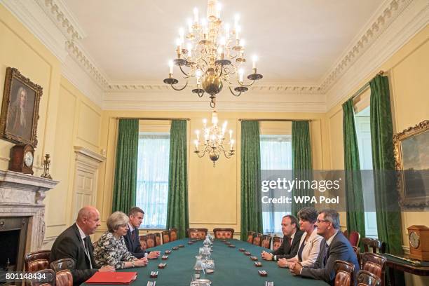 Prime Minister Theresa May sits with First Secretary of State Damian Green , and Parliamentary Secretary to the Treasury, and Chief Whip, Gavin...