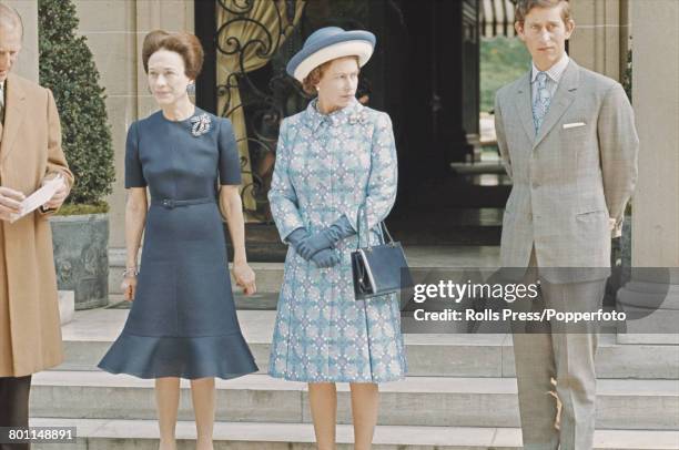 Queen Elizabeth II, Prince Philip, Duke of Edinburgh and Prince Charles stand together with Wallis Simpson, Duchess of Windsor during a visit by the...