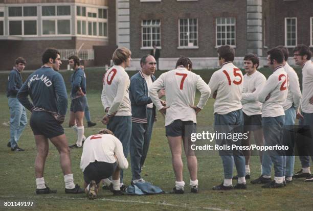 Alf Ramsey , manager of the England national football team pictured in centre with squad members during a training session at Roehampton, London on...