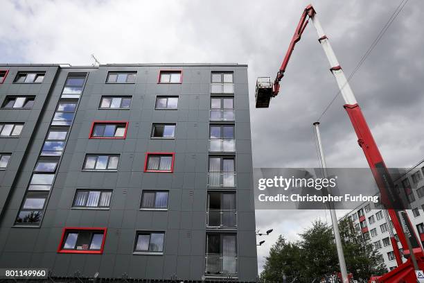 Workers remove cladding for testing from one of the tower blocks in Salford City on June 26, 2017 in Salford, England. In the wake of the Grenfell...
