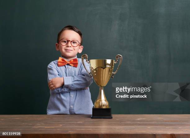 cute child with a golden trophy - school award imagens e fotografias de stock