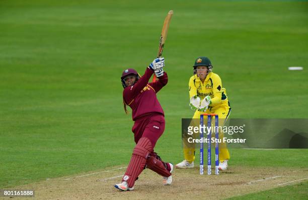 West Indies batsman Anisa Mohammed hits out watched by wicketkeeper Aliyssa Healy during the ICC Women's World Cup 2017 match between Australia and...
