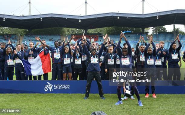 Team France celebrates winning the bronze medal during the trophy ceremony on day 3 of the 2017 European Athletics Team Championships at Stadium...