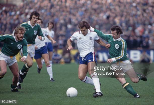 English international professional footballer Ray Wilkins is tackled by Liam Brady of the Republic of Ireland during the UEFA European Championship...