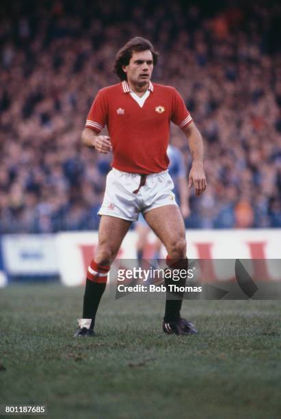 English professional international footballer Ray Wilkins pictured in action for Manchester United Football Club against Manchester City at Maine...