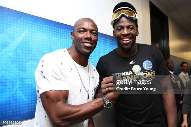 Former NFL player, Terrell Owens poses for a photo with Draymond Green of the Golden State Warriors after winning Game Five of the 2017 NBA Finals...