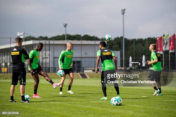 Rehab Coach Andreas Bluhm, Mamadou Doucoure, Marvin Schulz, Raffael and Tony Jantschke during a training session of Borussia Moenchengladbach at...