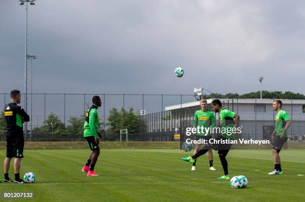 Rehab Coach Andreas Bluhm, Mamadou Doucoure, Marvin Schulz, Raffael and Tony Jantschke during a training session of Borussia Moenchengladbach at...