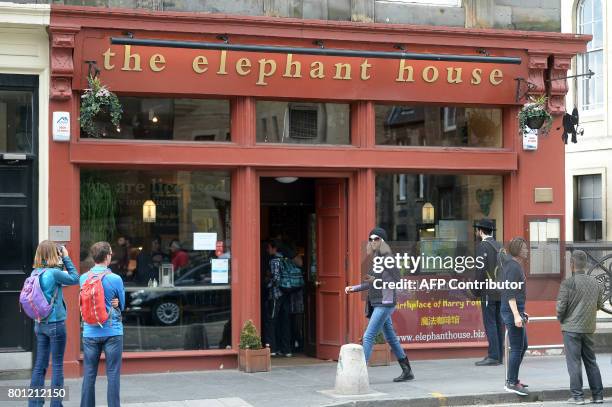 People look at the Elephant House cafe in Edinburgh, Scotland on June 26 cited with being the location where author J.K. Rowling started writing the...