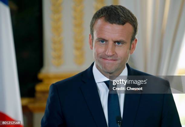 French President Emmanuel Macron makes a statement next to Ukrainian President Petro Poroshenko during a joint press conference after a meeting at...