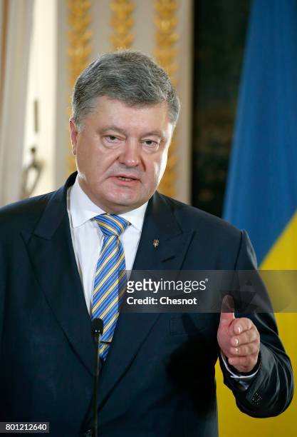 Ukrainian President Petro Poroshenko makes a statement next to French President Emmanuel Macron during a joint press conference after a meeting at...