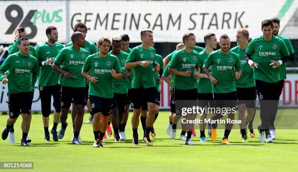 The team of Hannover 96 warms up before a Hannover 96 training session at HDI-Arena on June 26, 2017 in Hanover, Germany.