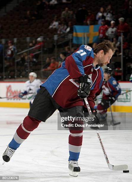 Peter Forsberg of the Colorado Avalanche takes the ice for the first time since rejoining the team as they warm up prior to facing the Vancouver...