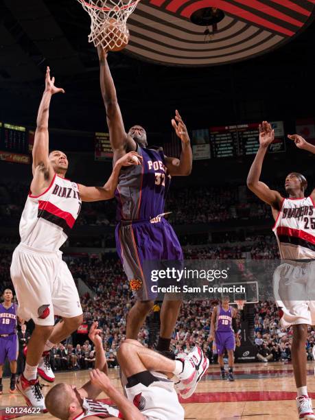 Shaquille O'Neal of the Phoenix Suns goes up for a shot over Joel Przybilla of the Portland Trail Blazers during a game on March 4, 2008 at the Rose...