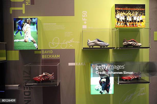 The Adidas boots of soccer stars David Beckham and Kaka are seen in a showcase during the announcement of the results 2007 of the sporting goods...