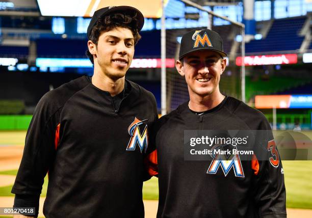 Christian Yelich of the Miami Marlins with draft pick Brian Miller before the game between the Miami Marlins and the Chicago Cubs at Marlins Park on...