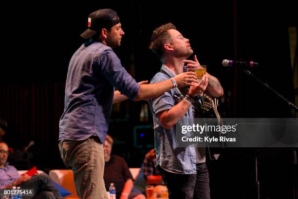 David Cook and Zachary Levi perform at the Big Slick Celebrity Party & Live Auction during the Big Slick Celebrity Weekend benefiting Children's...