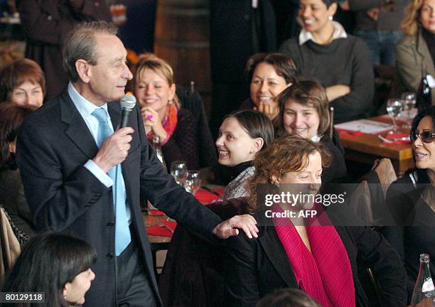 Paris Mayor Bertrand Delanoe flanked by Frederique Calandra , candidate in the 20th Paris district, delivers a speech on March 5 in Paris, during a...