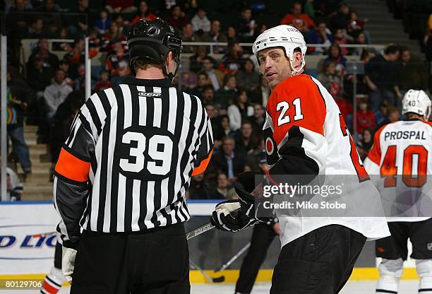 Jason Smith of the Philadelphia Flyers and referee Gord Dwyer talk during their game against the New York Islanders on March 1, 2008 at Nassau...